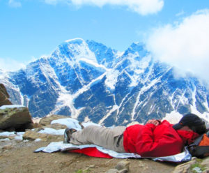 sleeping man on top of mountain